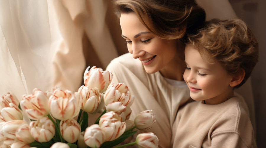 A woman and a young child are admiring tulips