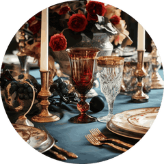 Opulent table setting with red roses and vintage glassware