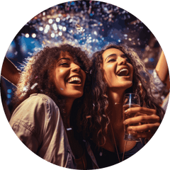 Two women dancing with drinks