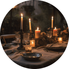 Romantic candlelit table with dark glasses and rustic decor
