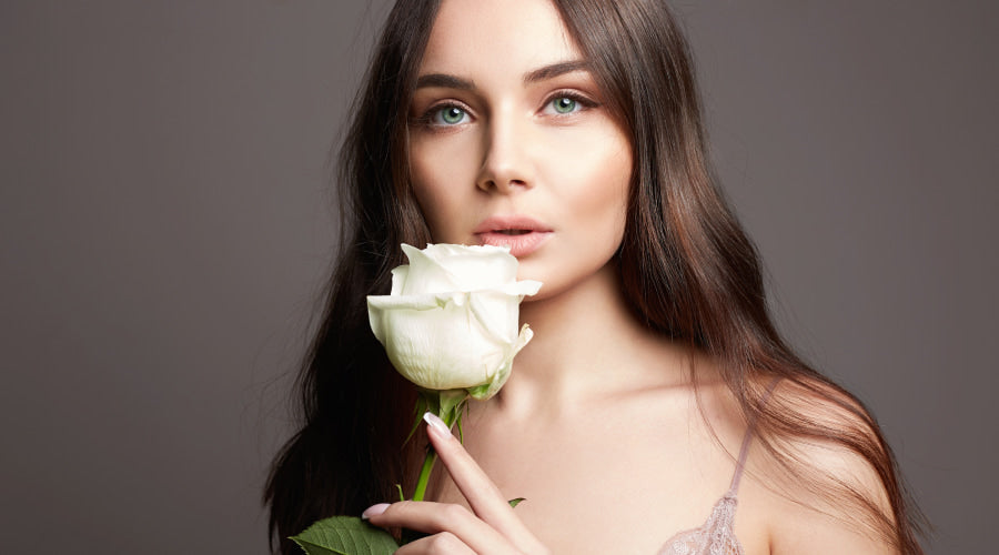 Woman with a single white rose