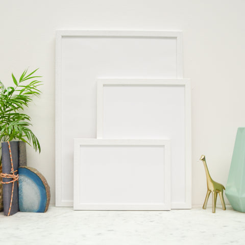 white picture frames - A5 photo frame, a4 frame and a3 frame stood together