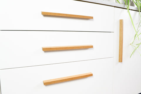 Long wooden handles, oak wood cabinet pulls on white cupboards and drawers