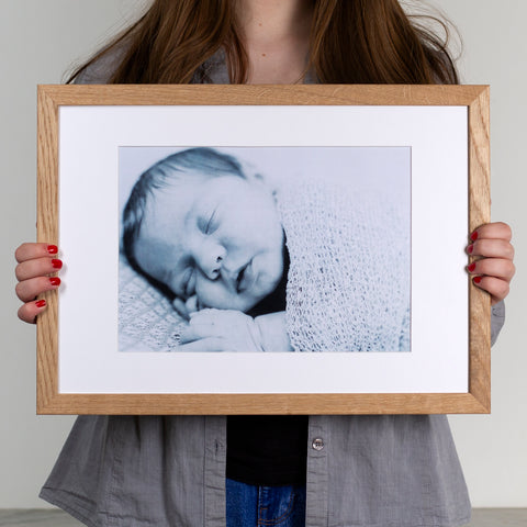 A3 oak picture frame in a young woman's hands