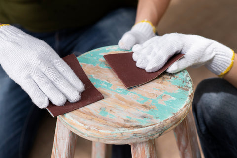 Upcycling a stool, sanding painted wood