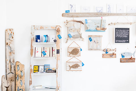 various hanging art in a coastal beach style