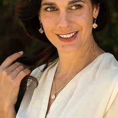 Woman wearing Gold Pyramid Shaped Earrings Featuring Handwoven Metal Fabric and Glass in 14K Yellow and Rose Gold Fill