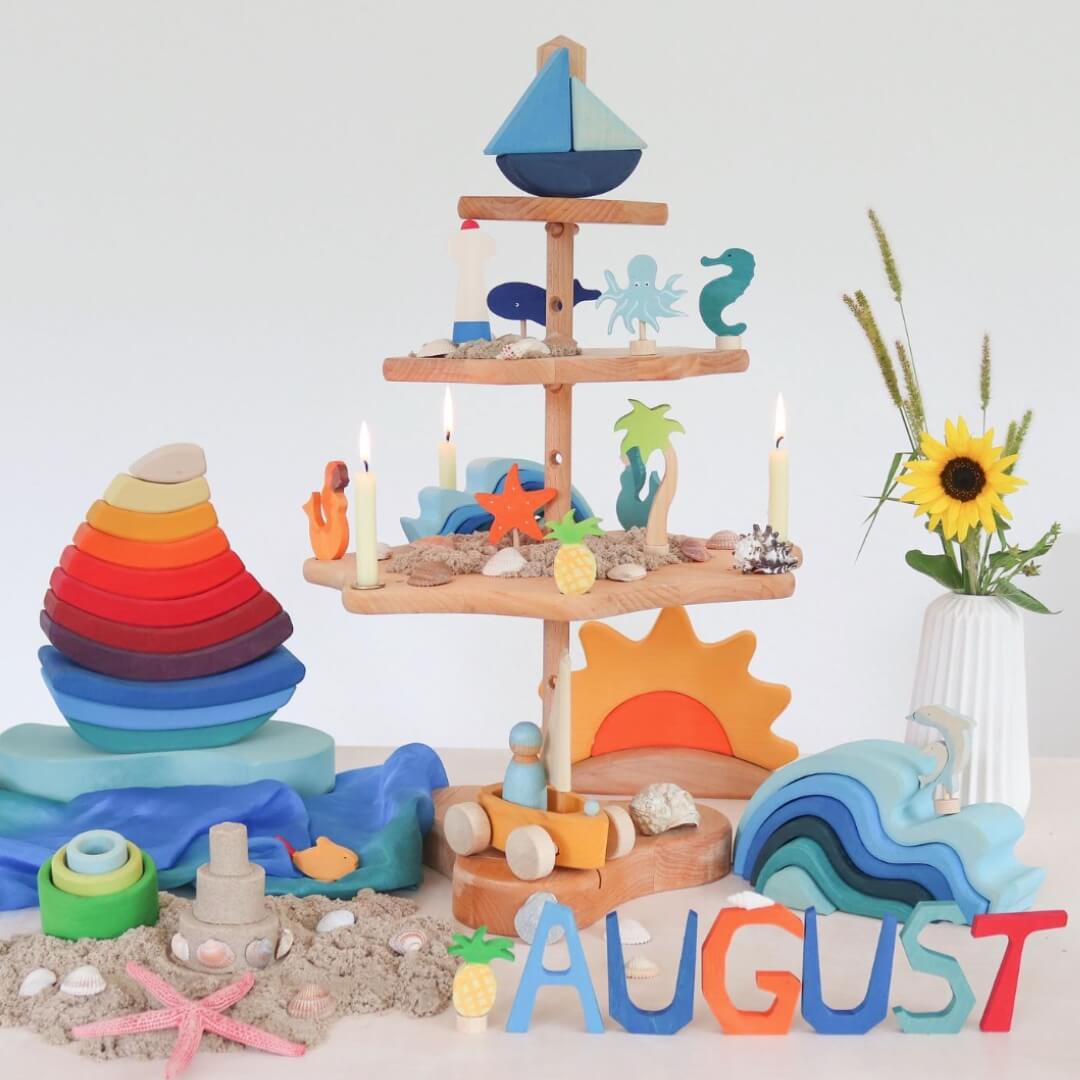 Decorative Seasonal Display: August (Image Credit: @grimmswoodentoys)