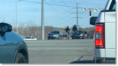 Darkly Dressed Charlotte Cyclists