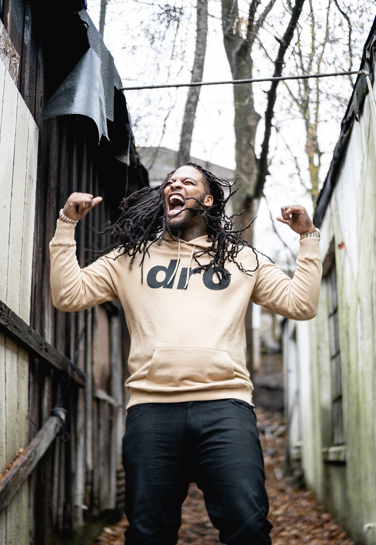 Waka Flocka Flame wearing DRO BOLO Rugby Long Sleeve Shirt Arms Up