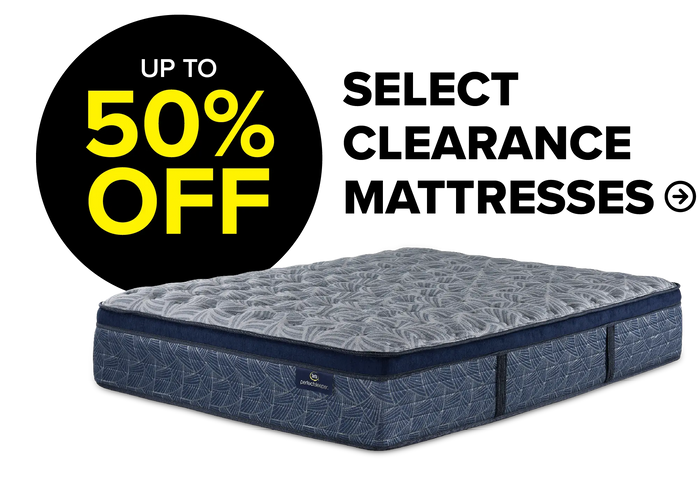 Up to 50% off Select Clearance Mattresses. Image shows a blue and grey patterned mattress.