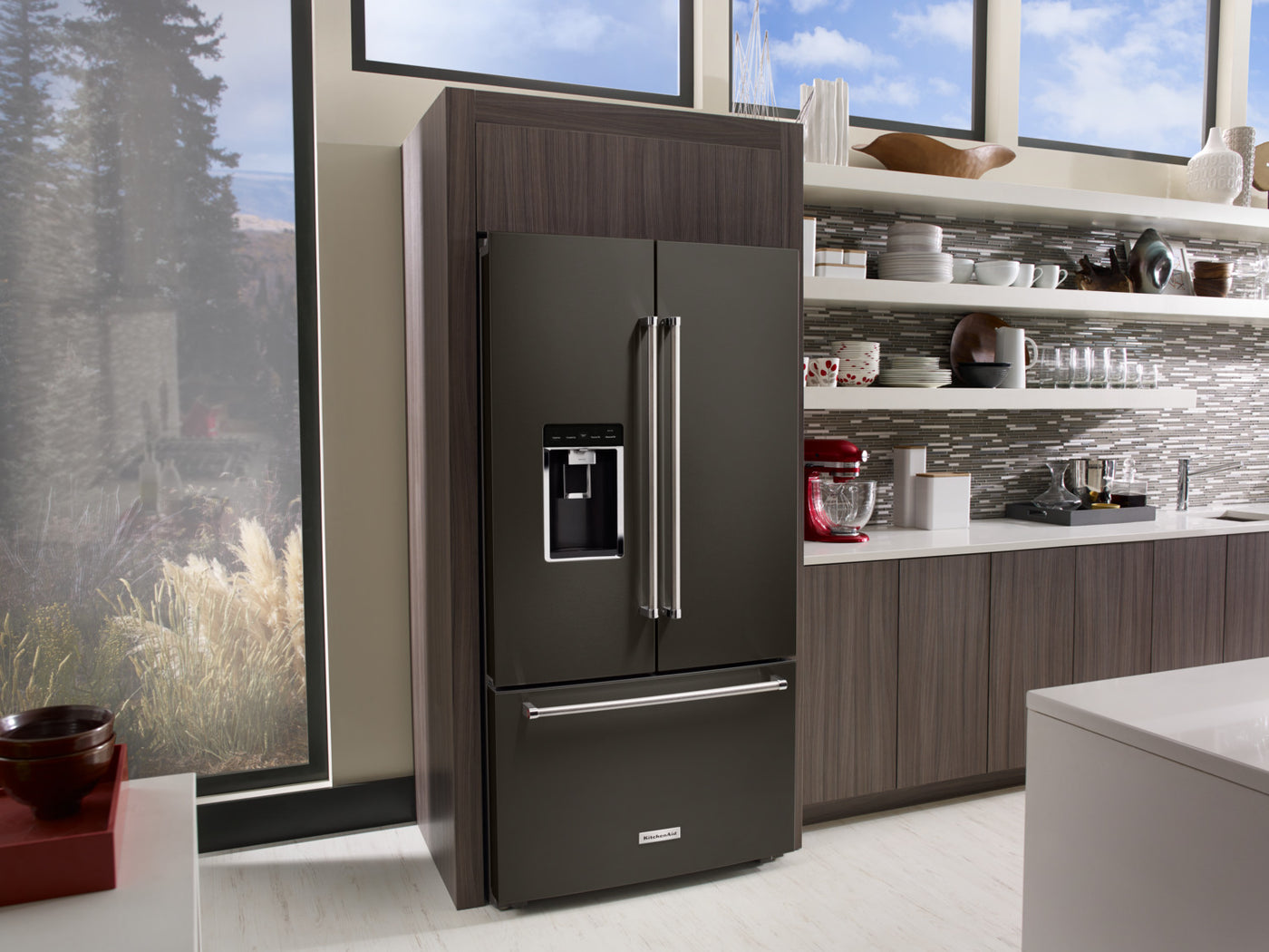 black and stainless steel refrigerator