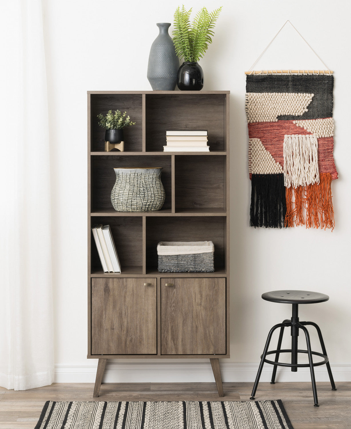 Drifted Grey Milo Mid-Century Modern Bookcase: 6 Shelves, 2 Doors, and Brushed Brass-Finished Knobs