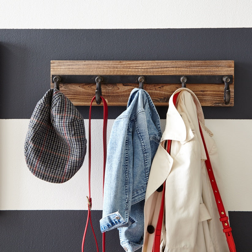 Rustic coat hooks placed in the entryway for hats, jackets, bags, and anything else that you need to hang-up