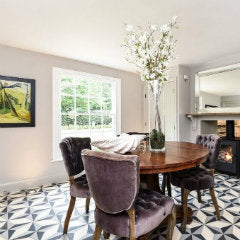 A Spanish dining room with encaustic floor tiles