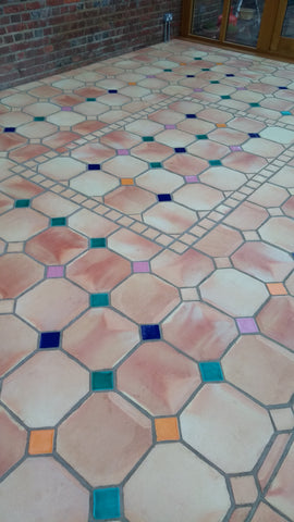 Terracotta octagons with coloured insets as a conservatory floor