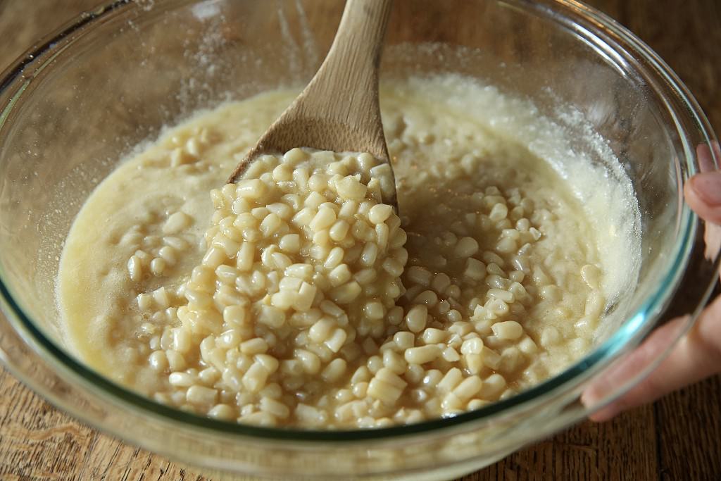 Stirring all ingredients for the corn pudding casserole to be baked in the Fontana brick oven