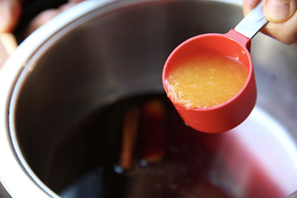 Orange juice to be cooked down with cranberries in wood-burning oven