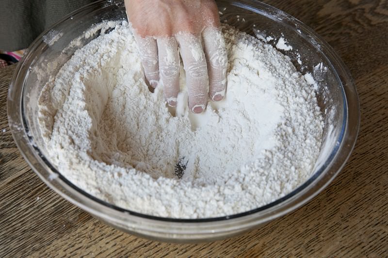 Create well in flour for bread baked in the Fontana wood-fired oven