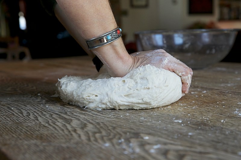 Knead dough for bread baked in the Fontana wood-fired oven