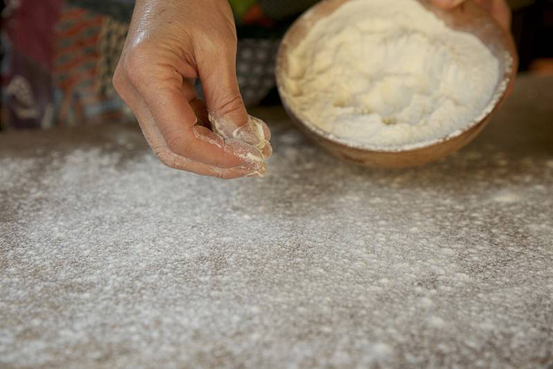 Dust the table with a thin layer of flour