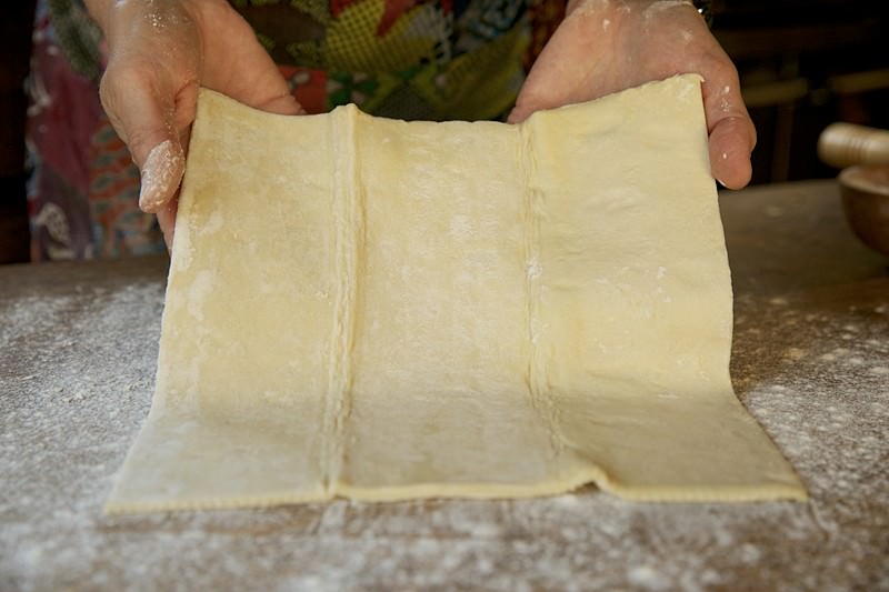 Place the thawed but cold puff pastry on the flour dusted table
