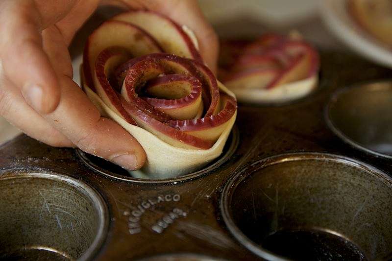 Apple roses with puffed pastry over apples and brown sugar to put in Fontana wood-fired oven 