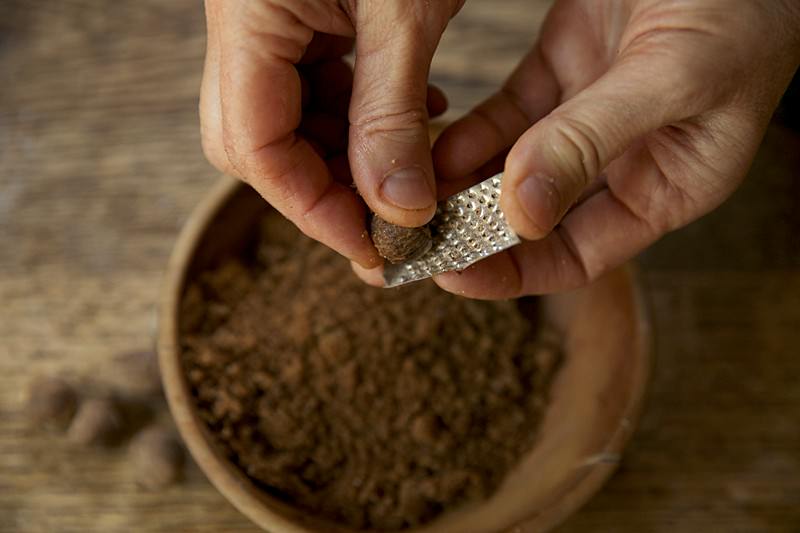 Grate a small amount of nutmeg into the sugar mixture