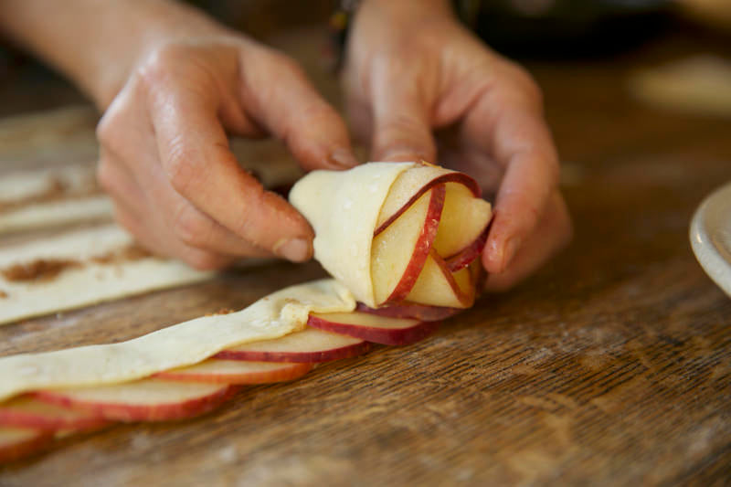 Apple roses with puffed pastry over apples and brown sugar to put in Fontana wood-fired oven 