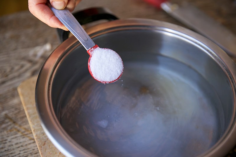 Salt placed in brine for turkey to be baked in Fontana wood-burning oven 