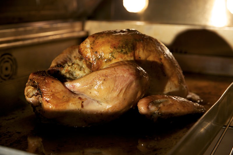 Placing turkey in the Fontana brick oven 