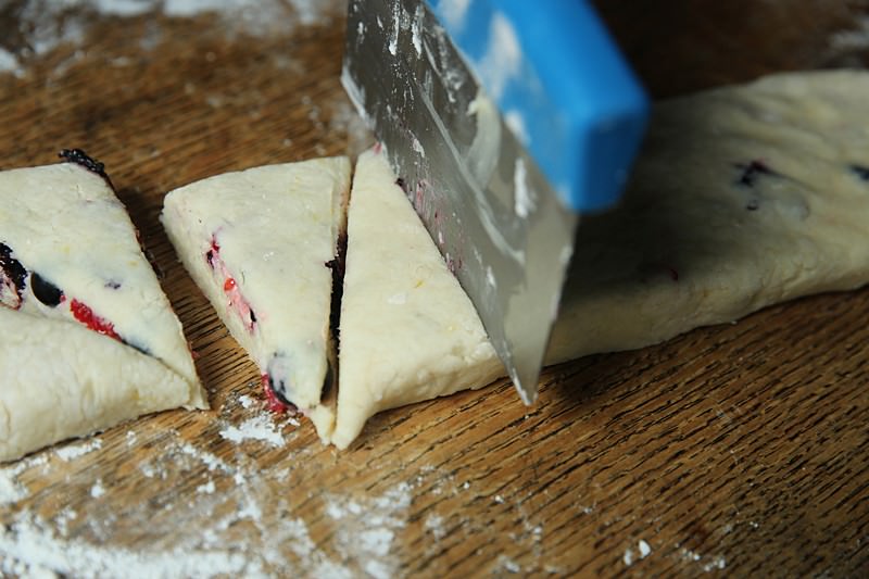 Cut the dough into even triangles with the dough cutter.