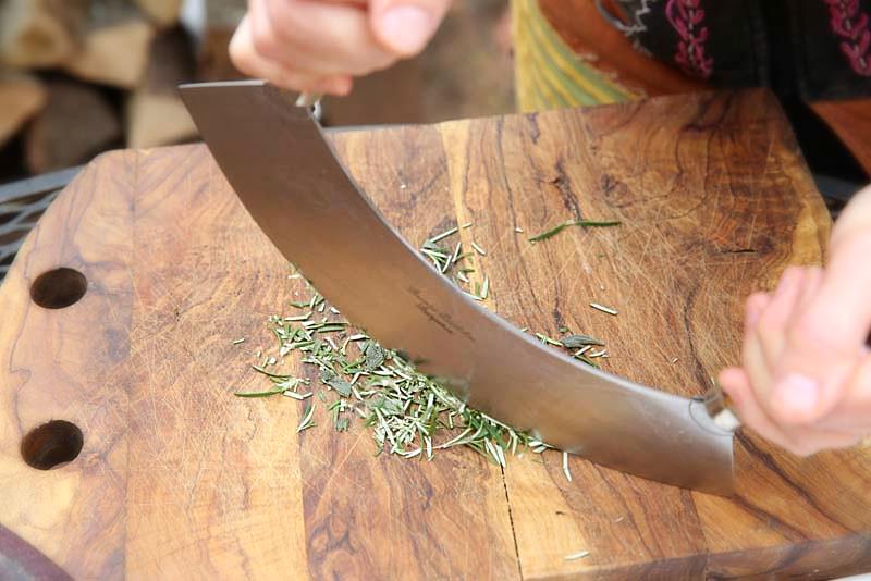 A mezzaluna is a perfect tool for chopping fresh herbs.