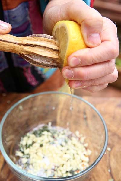 Add lemon juice and white wine to the herbs.