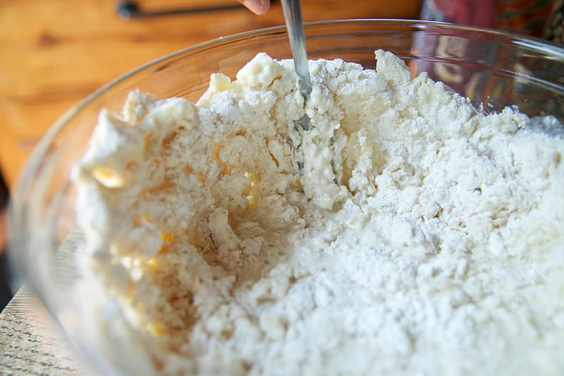 Press the lard and butter against the side of the bowl with a fork, forming flattened, irregular pieces