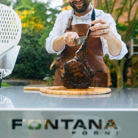 man grilling steak