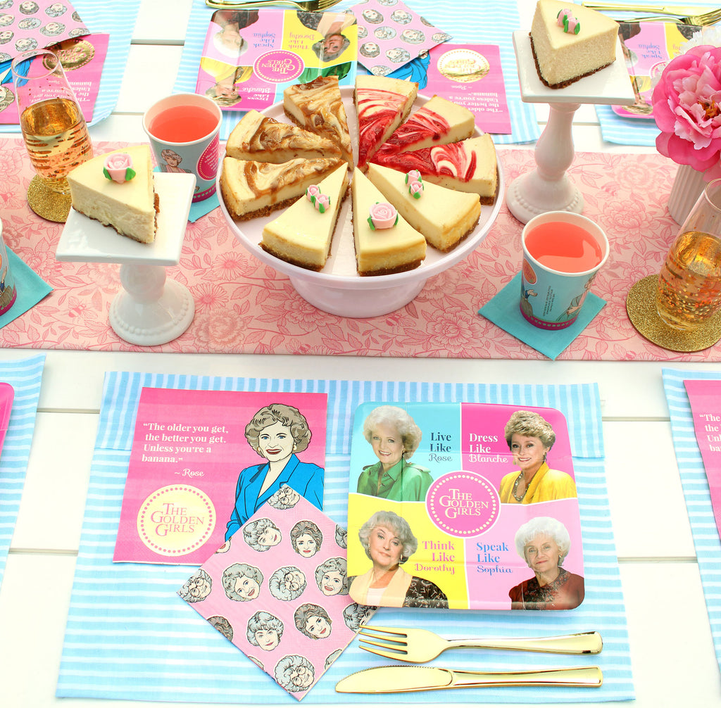 Golden Girls Place Setting includes Plate, cups, napkins, cheesecake, gold forks and knives, pedestals.