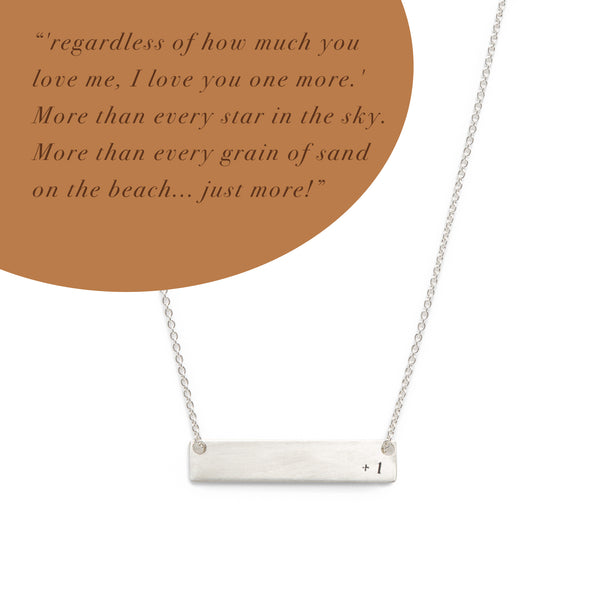 silver medium ID necklace with +1 stamped on it. Text reading "regardless of how much you love me, I love you one more.' More than every star in the sky. More than every grain of sand on the beach...just more!"