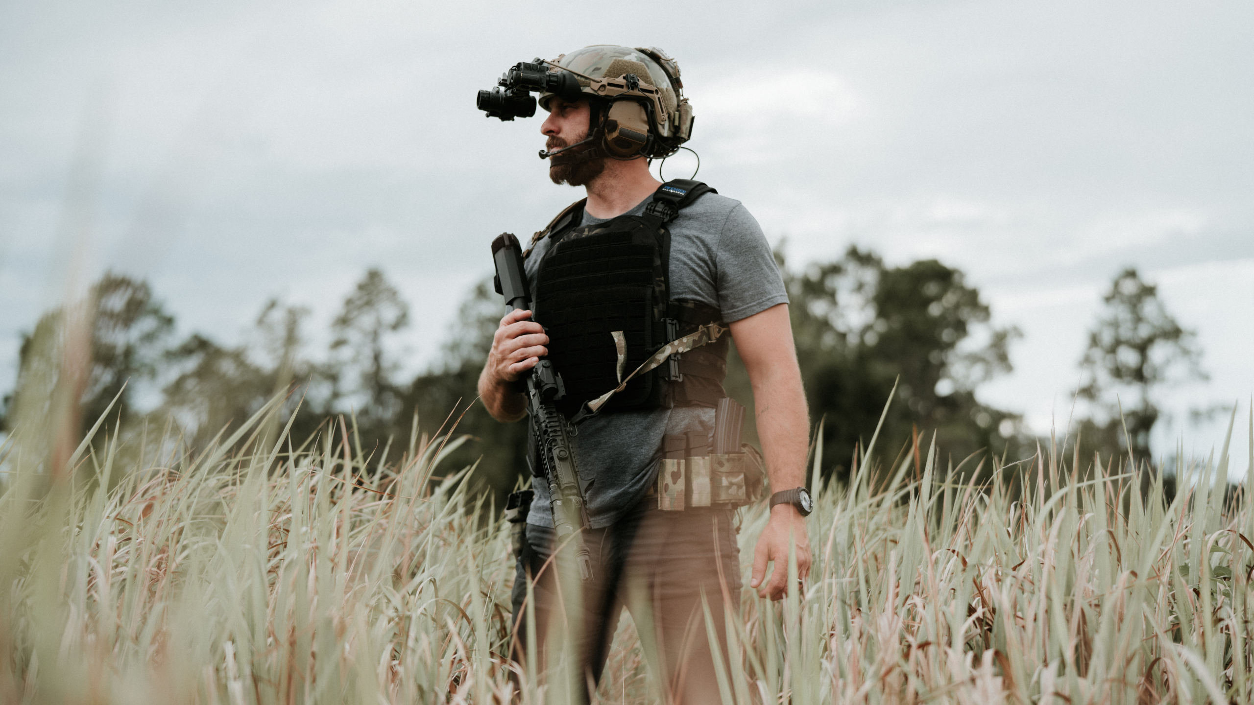 tactical guy with body armor plate carrier & gear outside