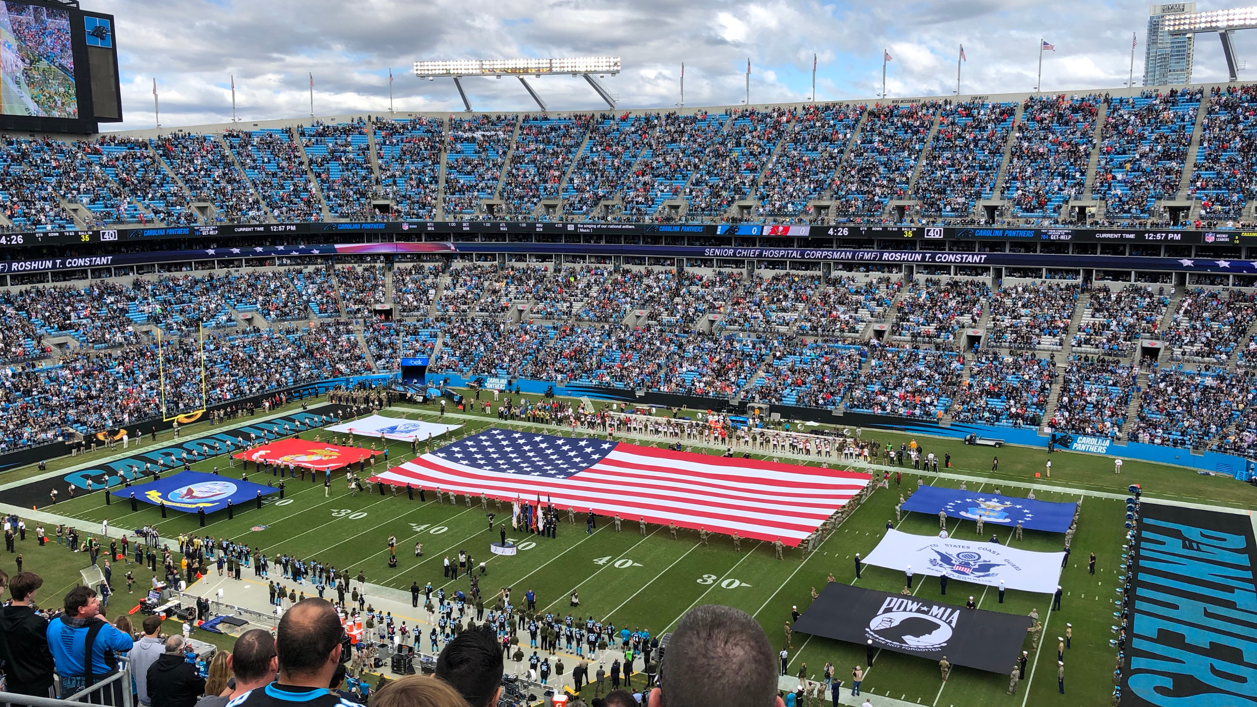 football stadium with american flag on the field