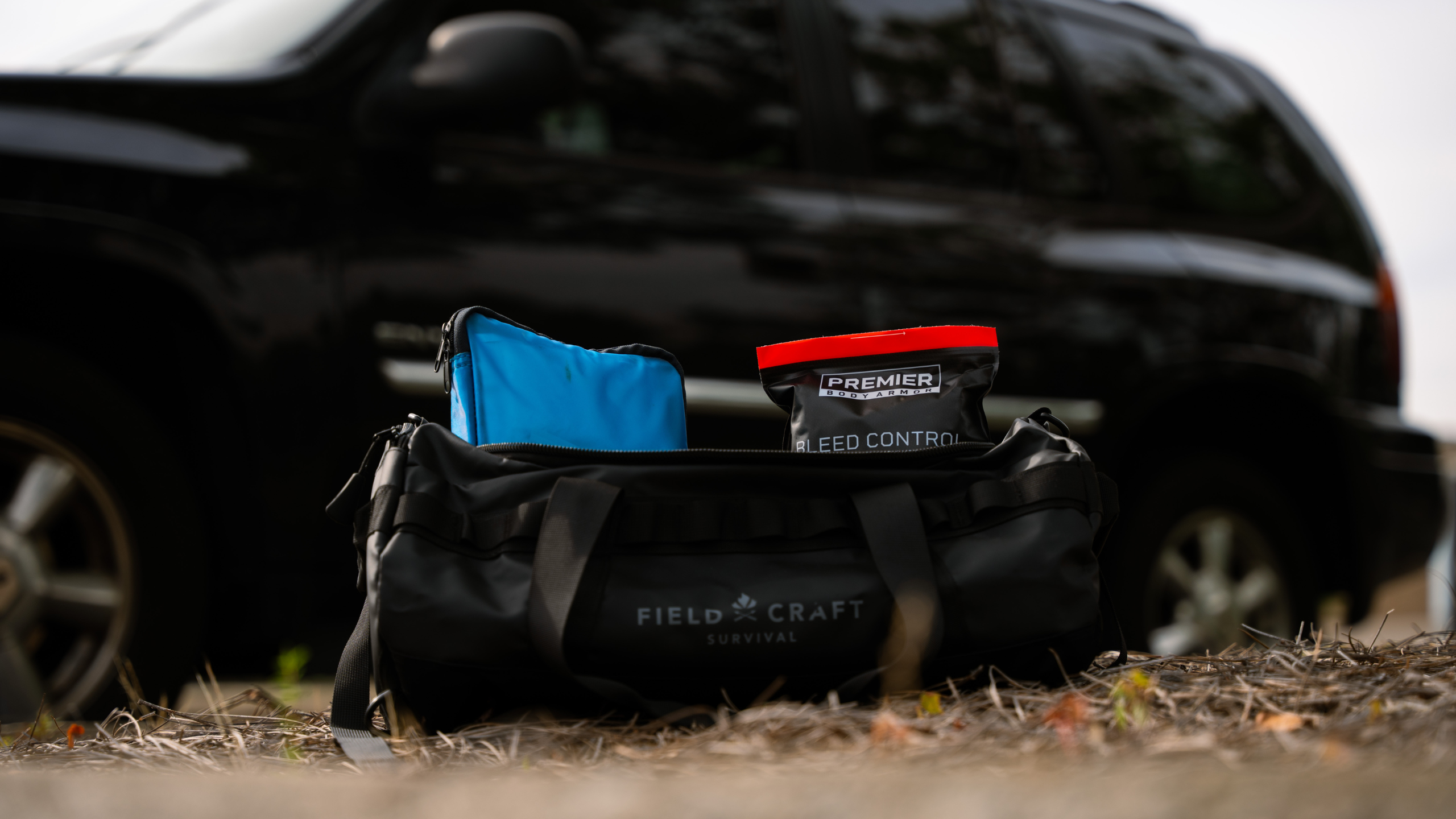first aid bag in front of car