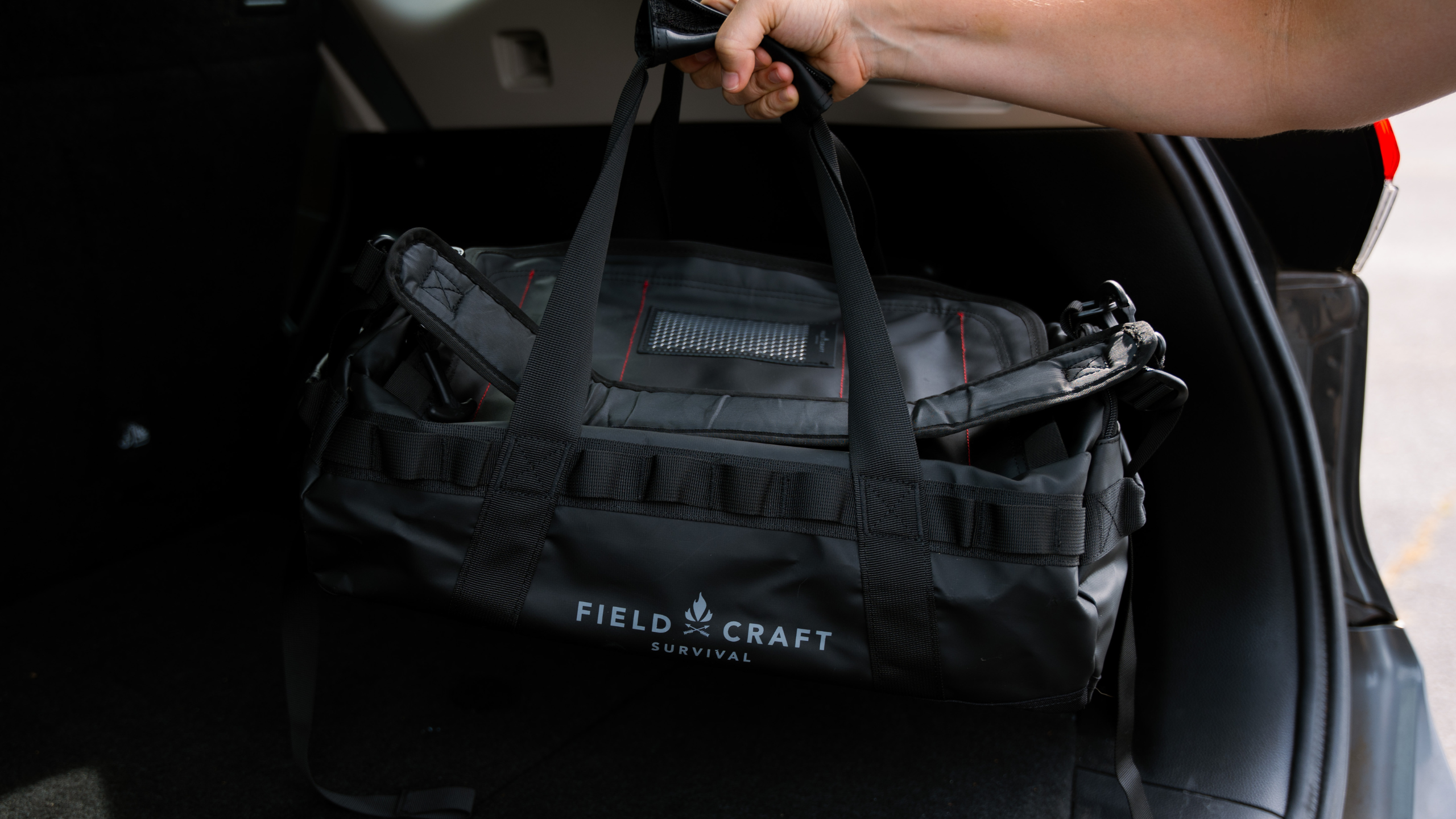 bag for first aid being put into a car