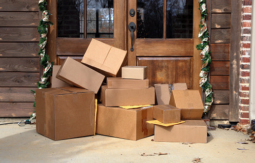 Image of delivery packages on a front porch. 