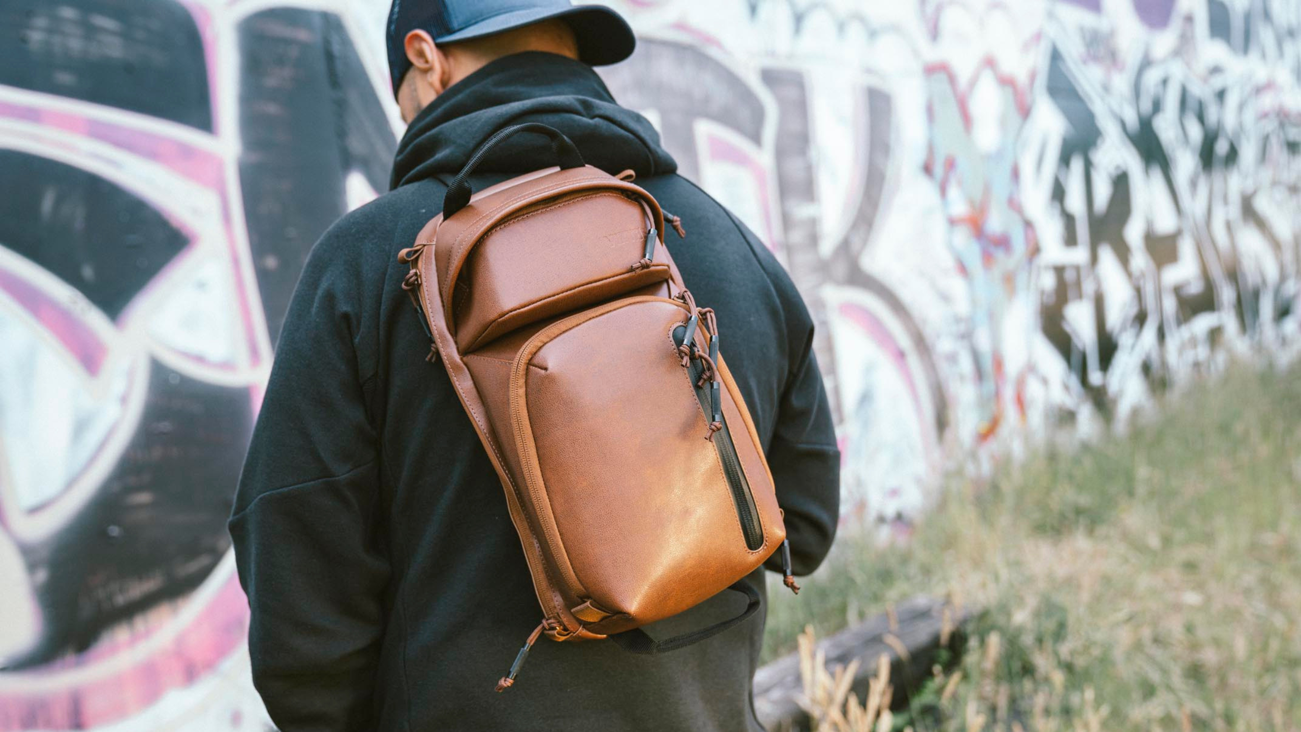 man with brown leather viktos cross body sling bag