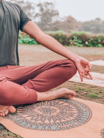 Yogi Meditating on a Cork Yoga Mat
