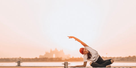 A beginner yoga pose at sunset