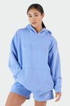 Girl Wearing Periwinkle Hoodie and Shorts