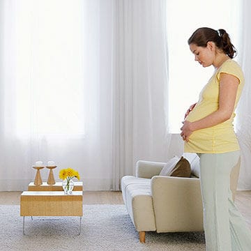 Pregnant woman in living room