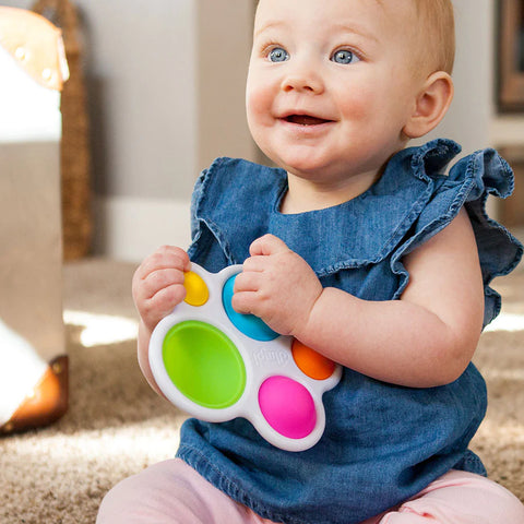 Image of baby playing with Fat Brain Toy Company's dimpl sensory toy