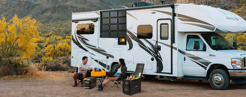A couple RVing using a BougeRV mini fridge, portable air conditioner, portable CIGS solar panel, and portable power station